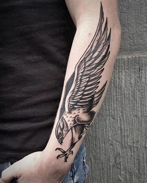 Blackwork falcon forearm tattoo @bobby_anders from @akaberlin. #Tattoosformen | Eagle wing ...