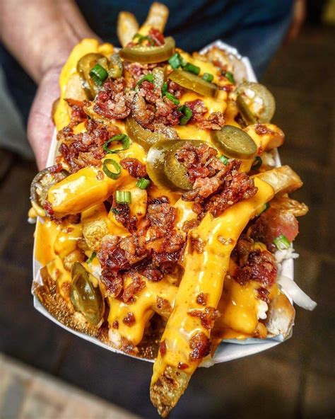 Loaded cheese fries with bacon and jalapeno - Yumm ! 🍕