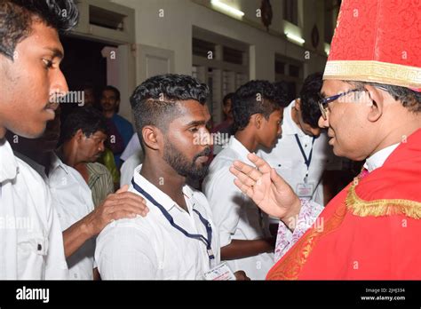 Catholic bishop is giving Confirmation sacrament Stock Photo - Alamy