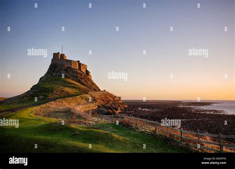 Lindisfarne Castle at sunrise on Holy Island, Northumberland, England. HDR Stock Photo - Alamy