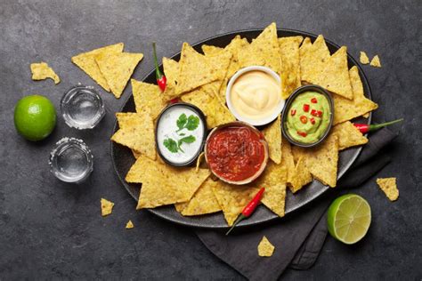 Mexican Nachos Chips and Tequila Stock Image - Image of cream, nachos: 169896529