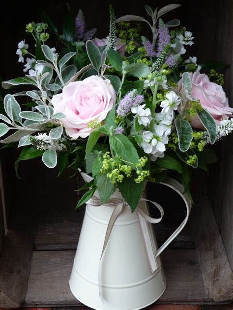 enamel jugs full of country flowers | Flower arrangements, July flowers, Rose arrangements