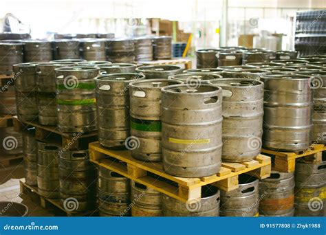 Beer Kegs. Many Metal Beer Keg Stand in Rows in a Warehouse Stock Photo - Image of aluminum ...