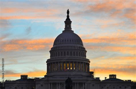 United States Capitol Building silhouette at sunrise Stock Photo ...