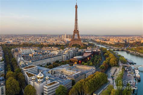 Over Paris Eiffel Tower and the 7th Arrondissement Photograph by Mike ...