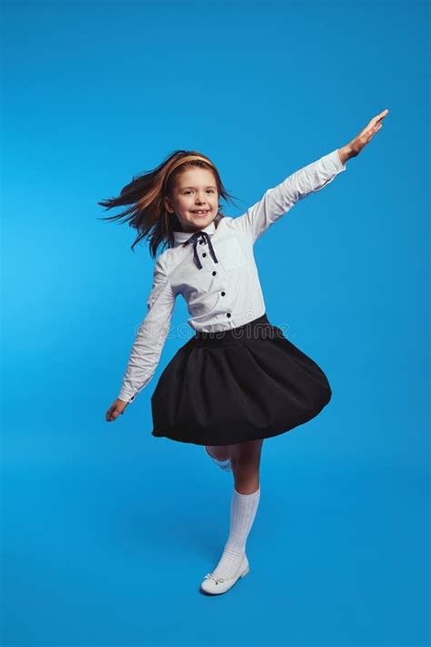 Funny Girl Spinning Fast in School Uniform Dress, Causing it To Flare Out Stock Photo - Image of ...