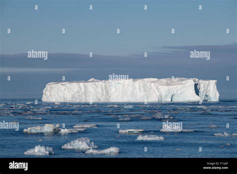 Antarctica, below the Antarctic Circle. Ice filled bay in the ...