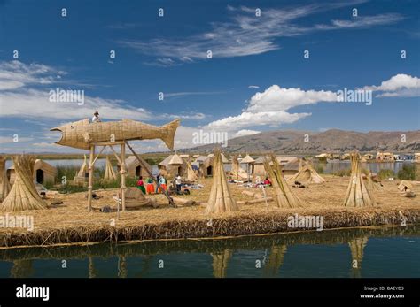 Peru, Lake Titicaca ,floating islands of the Uros, floating village with lookout tower in the ...