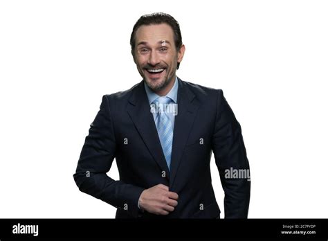 Laughing businessman standing in suit Stock Photo - Alamy