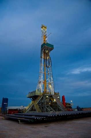 a) Onshore drilling rig located in Texas, USA and b) Offshore jack-up... | Download Scientific ...