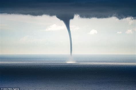 Video of a giant waterspout twister descending on Italian coastal town ...