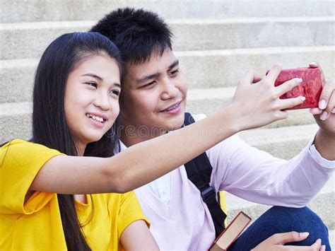 Smiling Couple Taking a Selfie Stock Image - Image of leisure, family: 146432963