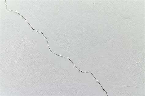 cracks in cement wall white cement wall 4302379 Stock Photo at Vecteezy