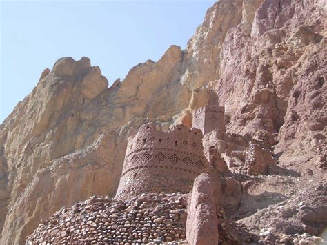 a castle built into the side of a mountain