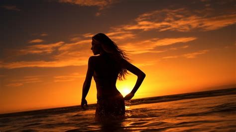 Premium Photo | Sunset beach woman silhouette