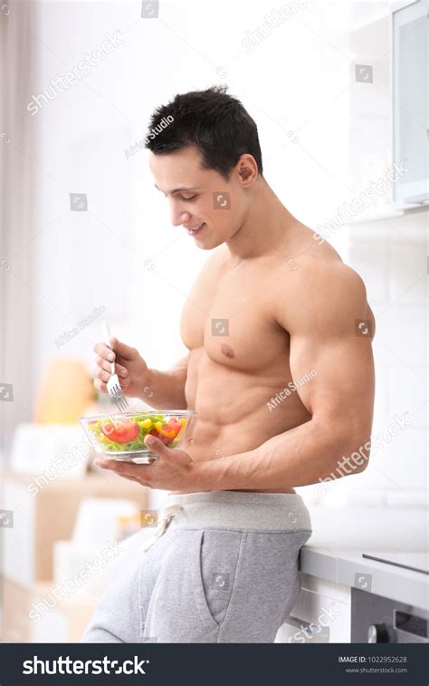 Handsome Muscular Young Man Eating Salad Stock Photo 1022952628 ...