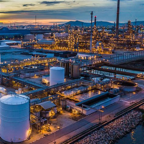 Aerial view oil terminal is industrial facility at night for storage of ...