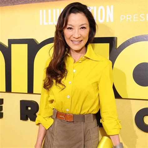 Michelle Yeoh looks gorgeous in yellow at Paris Fashion Week