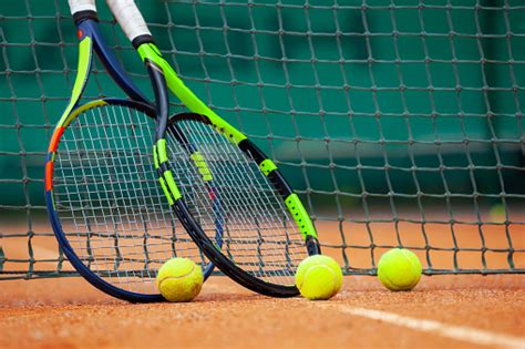 Tennis Rackets And Balls Leaned Against The Net Stock Photo - Download ...