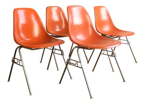 Orange Herman Miller Eames Fiberglass Shell Chairs - Set of 4- ELLEDecor.com Retro Dining Chairs ...