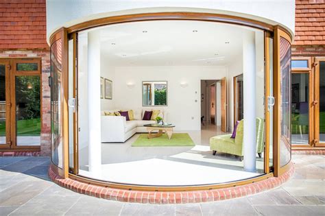 Large open Curved Glass Sliding Doors Sussex | Glass doors patio, Glass wall design, Sliding ...
