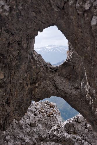 Snowy mountain summit through hole in rocky wall | The high … | Flickr