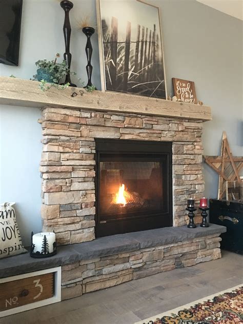 Rustic stone fireplace with asymmetric mantel and hearth. | Rustic stone fireplace, Brick ...