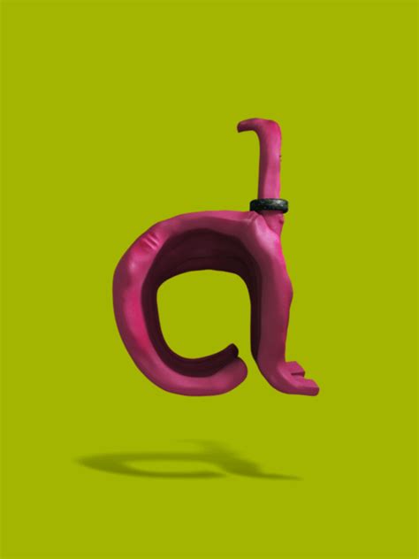 the letter c is made up of pink plastic letters on a green background with shadow