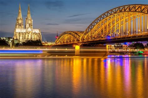 Premium Photo | Cologne Cathedral and Hohenzollern Bridge at night Germany