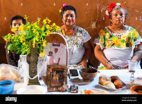 Merida family in front of their family altar during Hanal Pixan which is the celebration of the ...