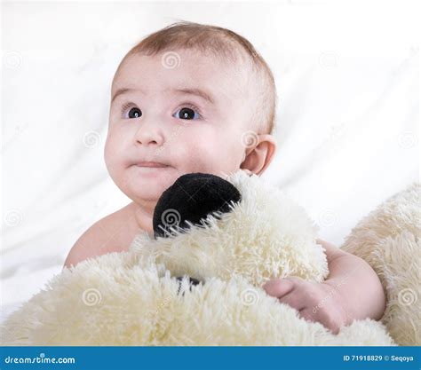 The Baby is Playing with Bear Stock Image - Image of face, bear: 71918829