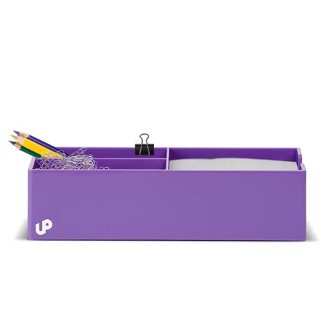 a purple box with two pencils and some other items in the bottom half ...