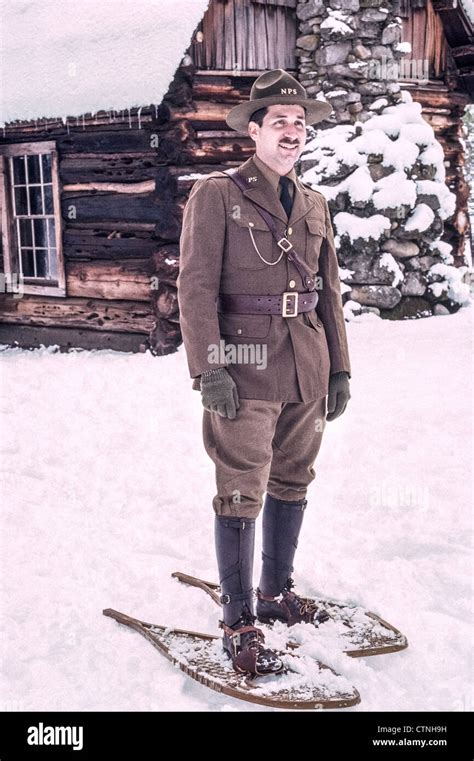 A Yosemite National Park ranger on old-fashioned snowshoes dresses in a vintage 1916 park ...