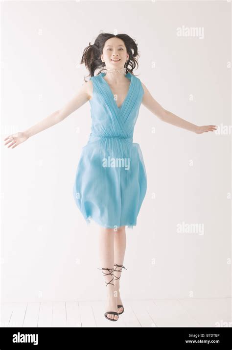 Woman in blue dress Stock Photo - Alamy