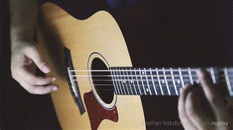 gallereplay | Man Plays an Acoustic Guitar