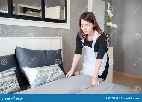 Young Maid Tidying Up Bed in Hotel Room, Cleaning Service Concept Stock Image - Image of bedroom ...