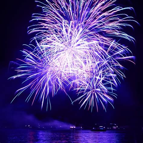 Blue colorful fireworks on the black ... | Stock Photo | Colourbox