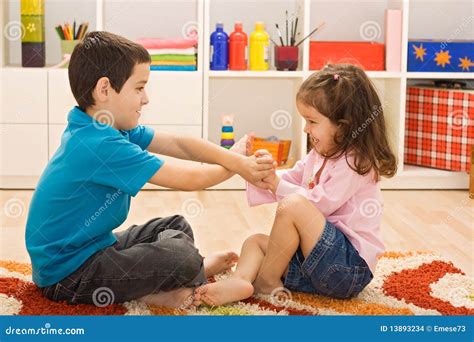 Two children playing stock photo. Image of floor, group - 13893234