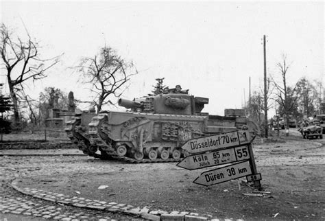 A Churchill AVRE tank enters a German town, 19 November 1944 | Online ...