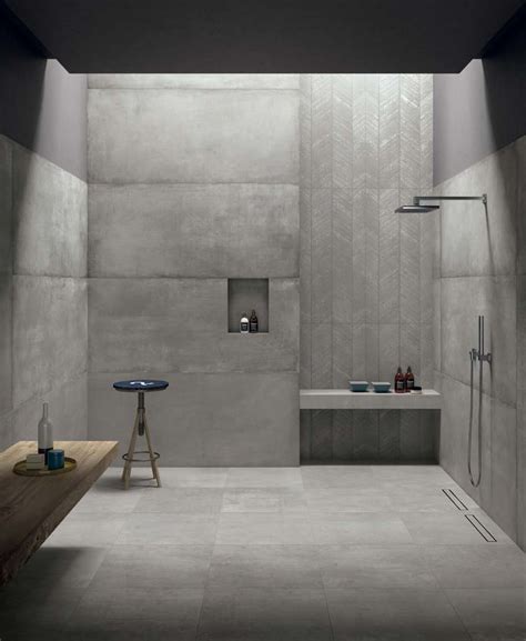 This modern grey bathroom has a cement look porcelain tile called Cemento 24"x24" on the floors ...