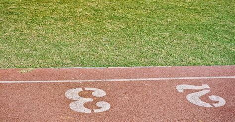 Green Grass Beside Brown Concrete Floor · Free Stock Photo