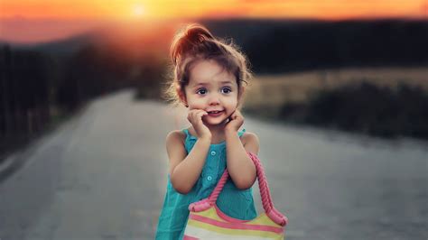 Download Sunset Baby Girl Wallpaper | Wallpapers.com