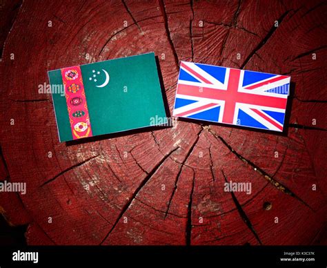 Turkmenistan flag with British flag on a tree stump isolated Stock Photo - Alamy