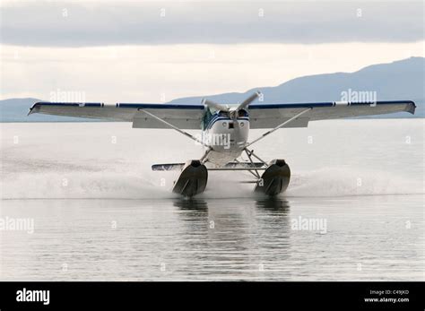 Cessna 182 float plane landing on Becharof Lake Alaska Stock Photo - Alamy