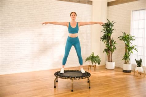 A 20-Minute Cardio Trampoline Workout For Stronger Legs & Core ...