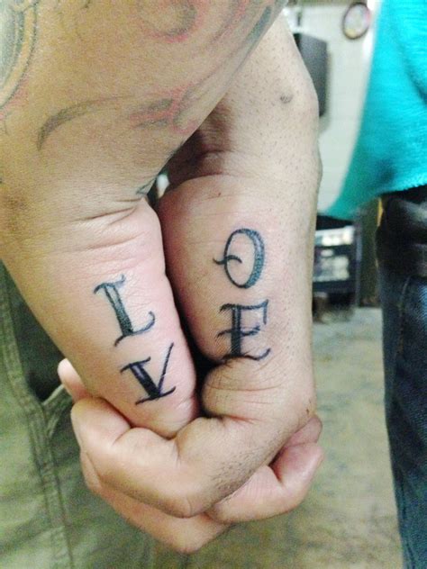 Couple hand holding LOVE Tattoo | Couples hand tattoos, Hand tattoo images, Cute hand tattoos