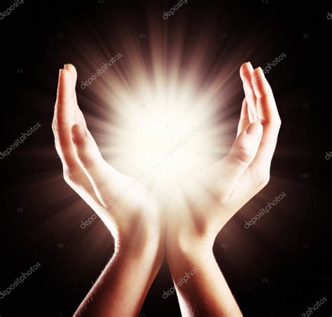 Light in woman hands Stock Photo by ©belchonock 84027814