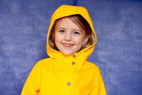 A Girl in a Yellow Jacket and a Mask in Nature Stock Photo - Image of ...