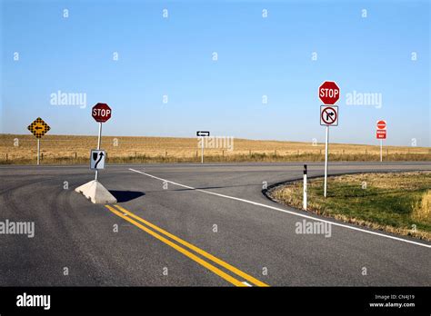 Signs on empty highway Stock Photo - Alamy