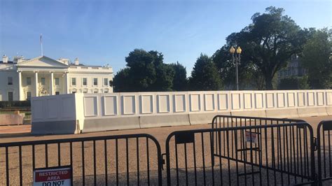 Construction starts on taller White House fence, giant panels block views | wusa9.com